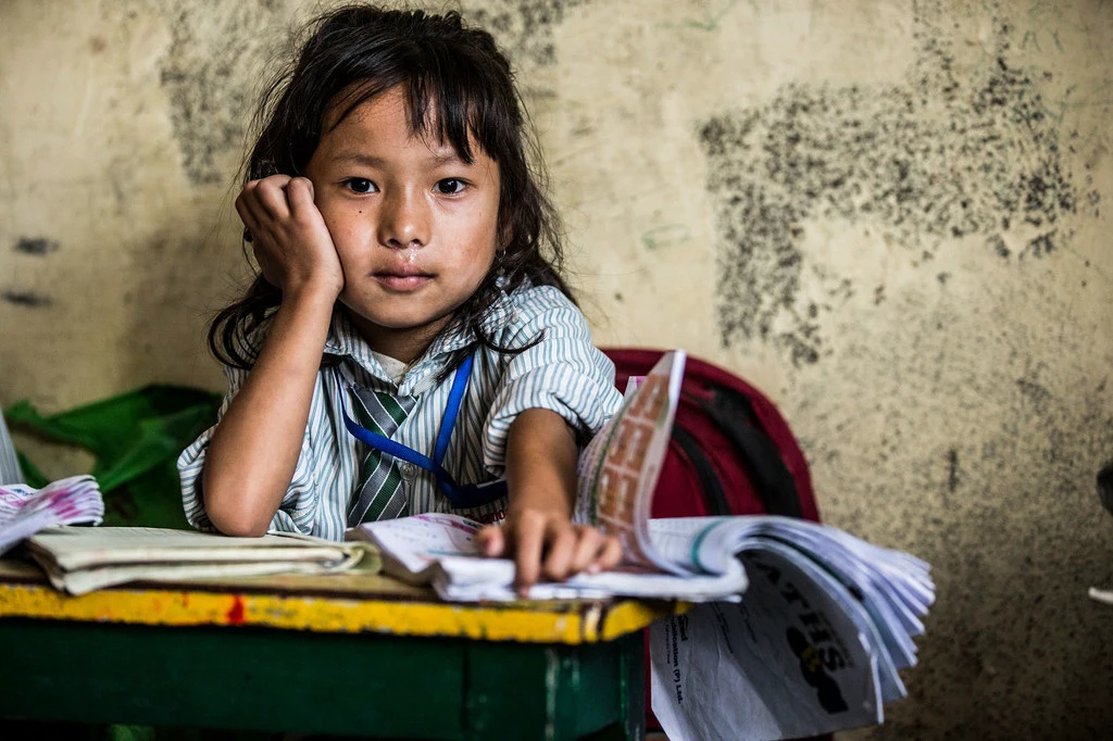 A young girl hard at study in Nepal. A young girl hard at study in Nepal.