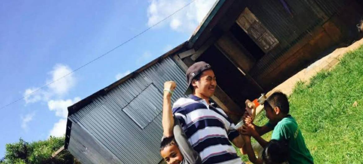 Haruki Ume plays with two boys during a visit to the Philippines in 2017. Haruki Ume plays with two boys during a visit to the Philippines in 2017.