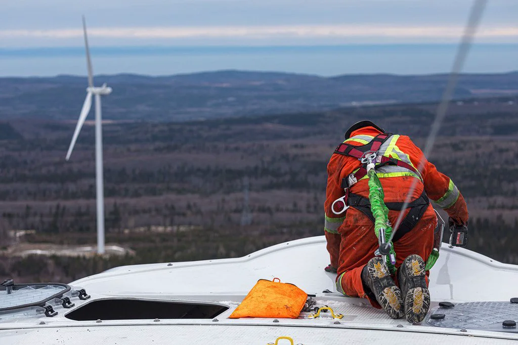 A technician works on a wind turbine blade in eastern Quebec, Canada. A technician works on a wind turbine blade in eastern Quebec, Canada.