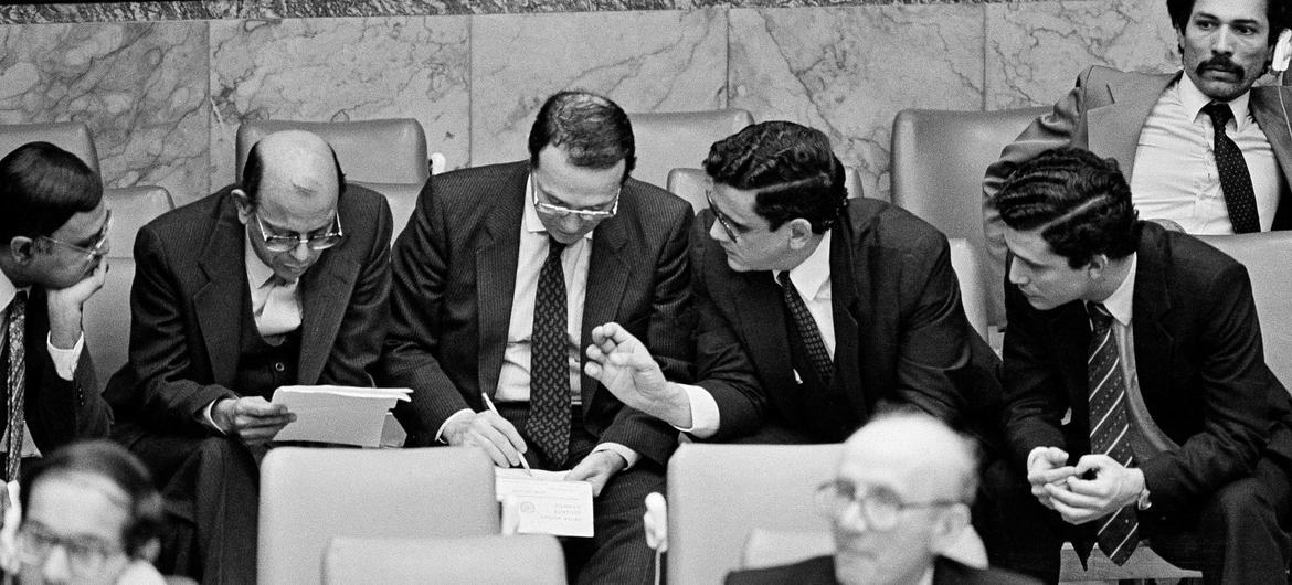 Security Council members from (beginning second from left) India, Egypt and Nicaragua confer informally on a draft resolution before the start of a meeting in New York in 1984. (file) Security Council members from (beginning second from left) India, Egypt and Nicaragua confer informally on a draft resolution before the start of a meeting in New York in 1984. (file)