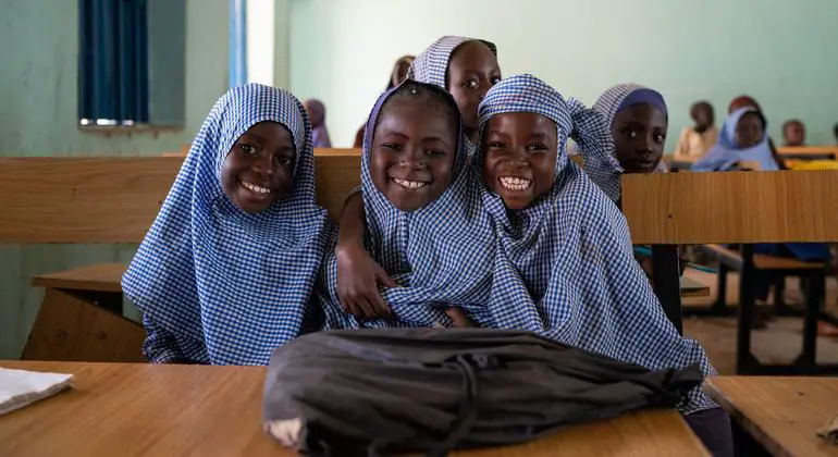 Students at a primary school in eastern Nigeria prepare await the beginning of class.