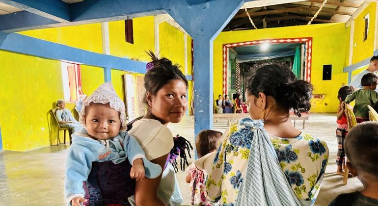 Mothers catch up after getting their babies immunized. Mothers catch up after getting their babies immunized.
