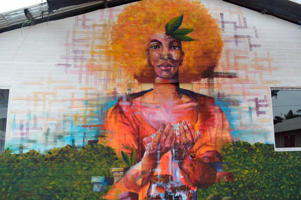 A mural in a rural area in Colombia shows the relationship between women and the environment.
