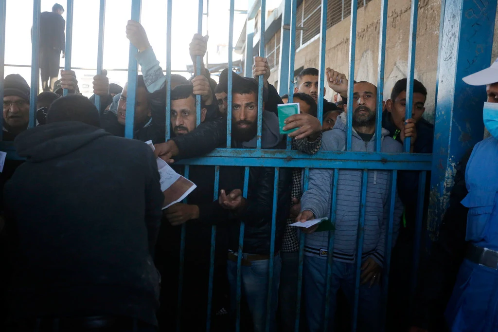 Gazans queue for food in January 2025 when it was more widely available in the enclave.
