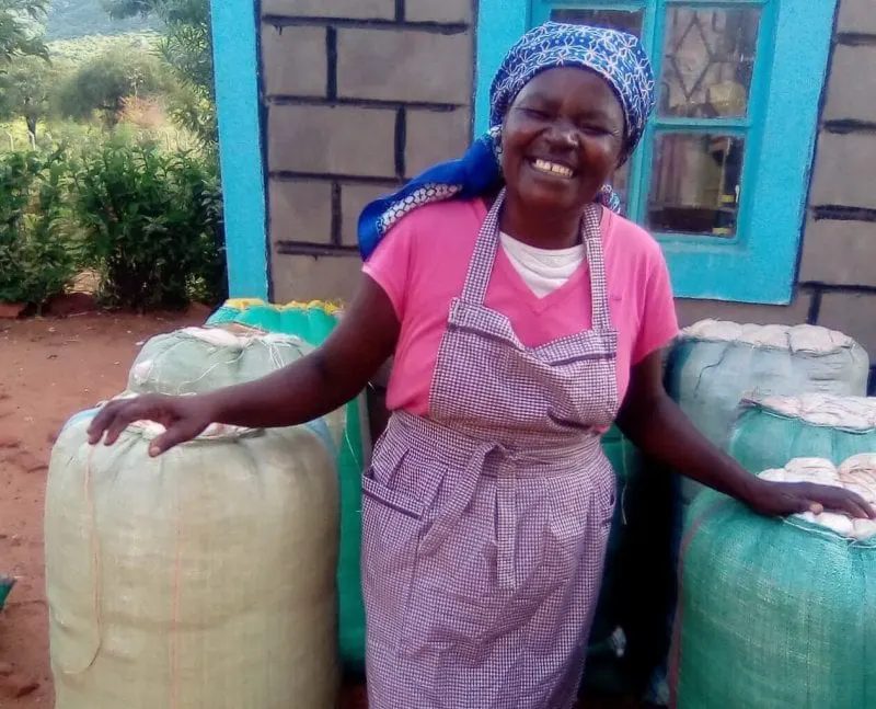 Winifred Kasambu and her Bt cotton harvests Credit: Cornell Alliance for Science