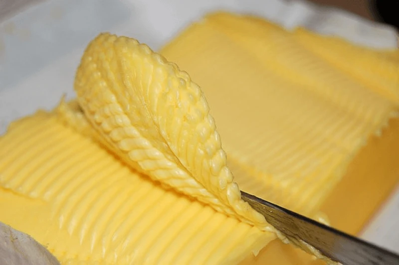 The process could use hydrocarbons mixed with oxygenates to create fatty acids, before adding glycerol to form triglycerides, a form of fat. To turn that into butter, water and an emulsifier are added before finally including beta carotene for color and rosemary oil. Credit: Dwayne Madden via CC-BY-2.0