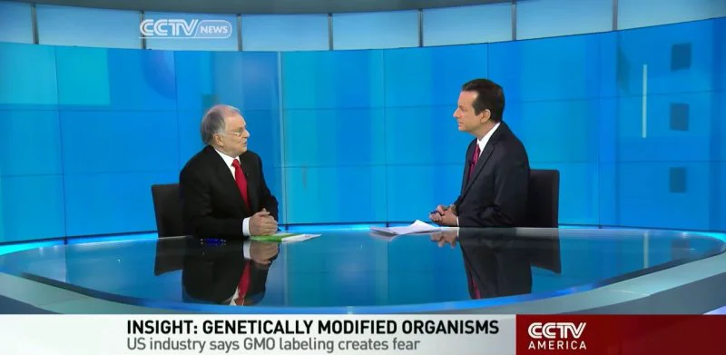 News anchor Mike Walter and CEO David Green discuss GMO regulation. Credit: Youtube