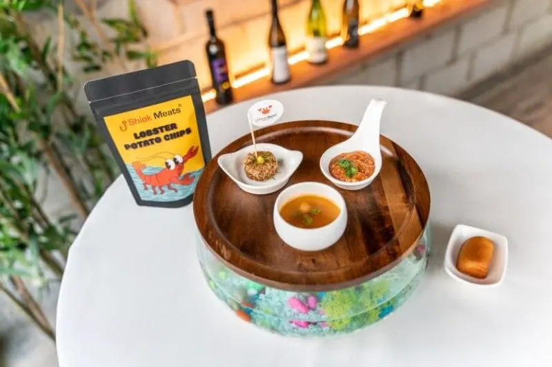 Cell based lobster chips, shrimp soup and crab dishes. Credit: Shiok Meats