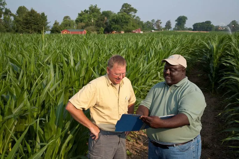 Farmer discussing carbon and GHG usage. Credit: USDA