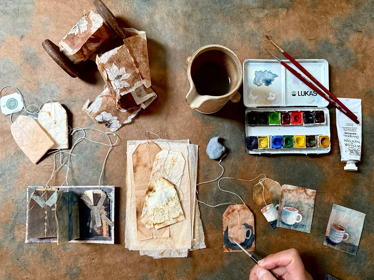 A table of painted tea bags