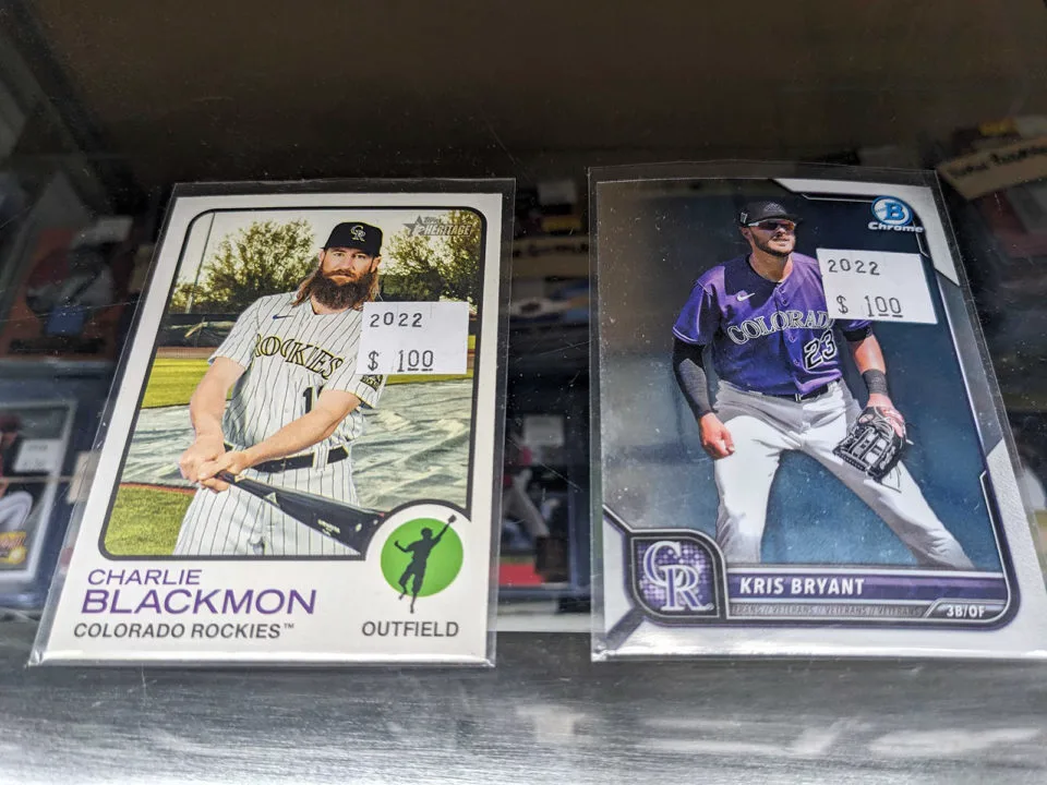 Charlie Blackmon baseball card and a Kris Bryant baseball card