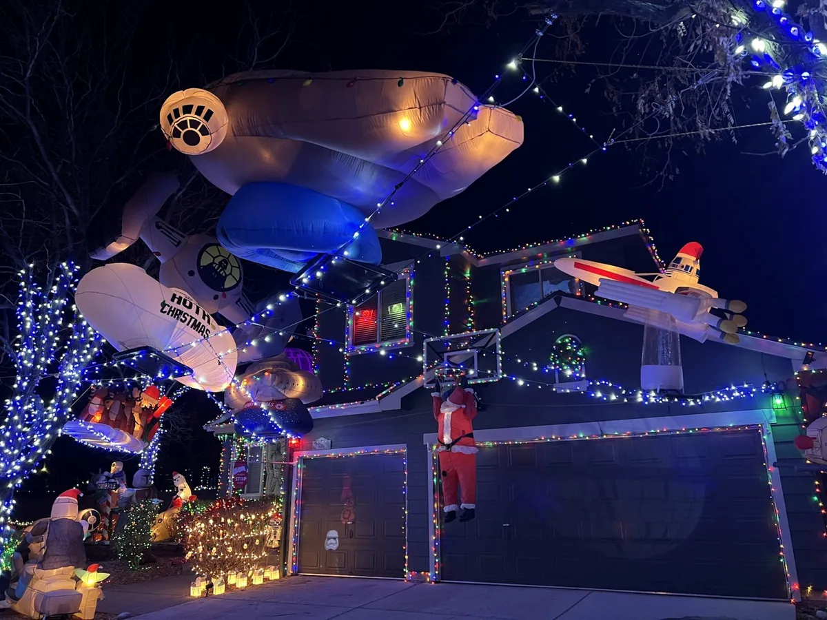House adorned with Star Wars inflatables and Christmas lights