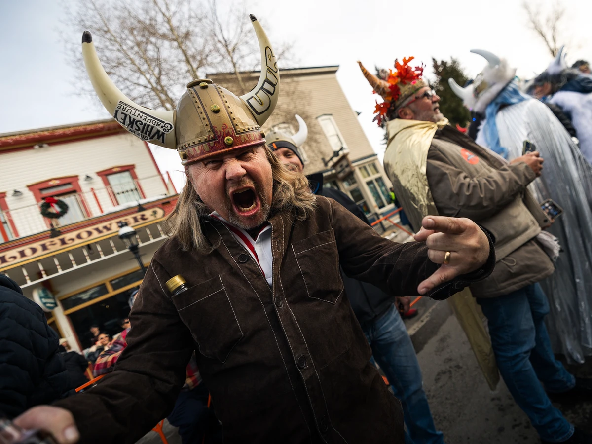A man wearing a Viking helmet