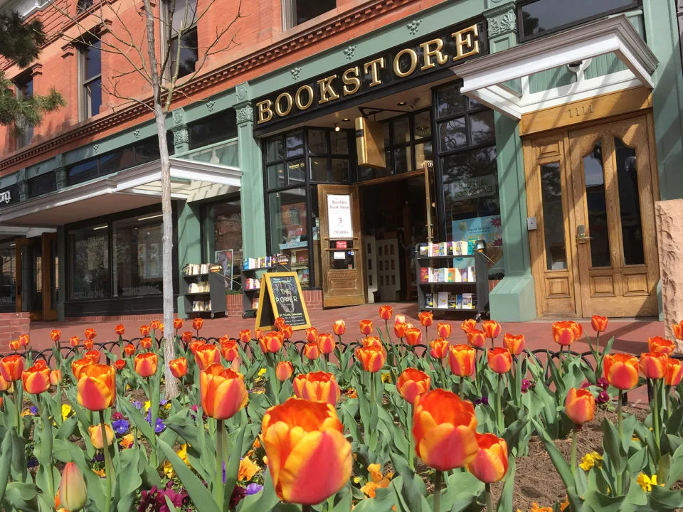 Facade of the Boulder Book Store with tulips in bloom in front