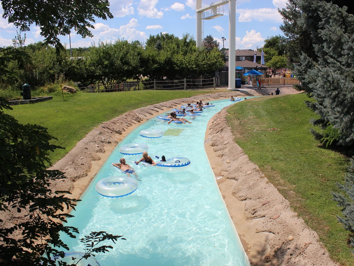 People in clear tubes float in a lazy river ride