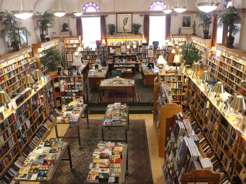 The ballroom lined with shelves filled with books at the Boulder Book Store