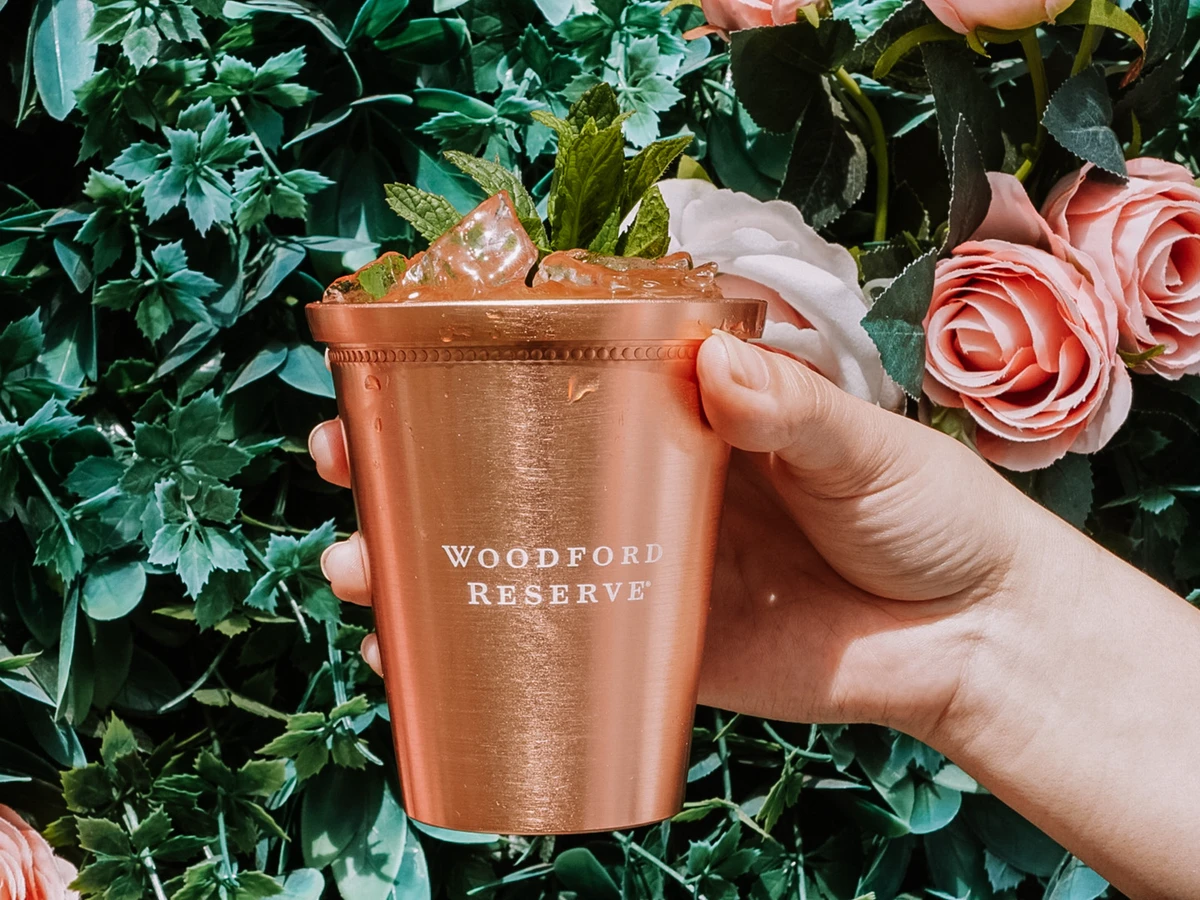 Hand holds up a mint julep