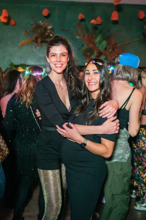 Sarah Battani Sams and Elizabeth Wellington on the dance floor of a MFT dance party