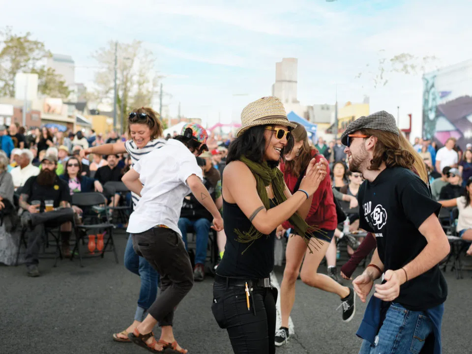 Dancing along Welton Street in Five Points