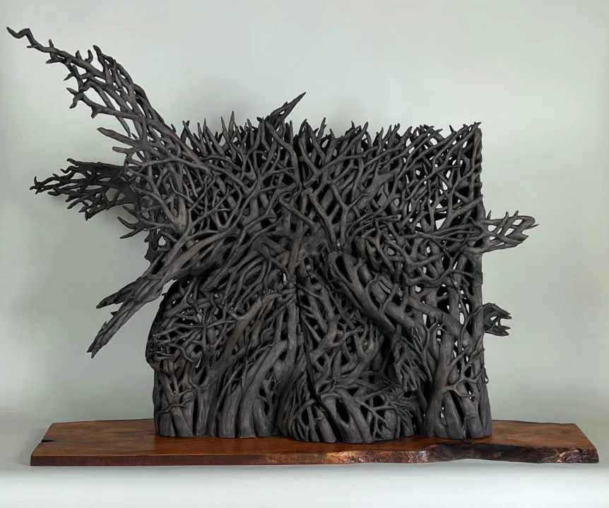 "Migration" by Dana K. Sense, a sculpture of weaving roots and branches.