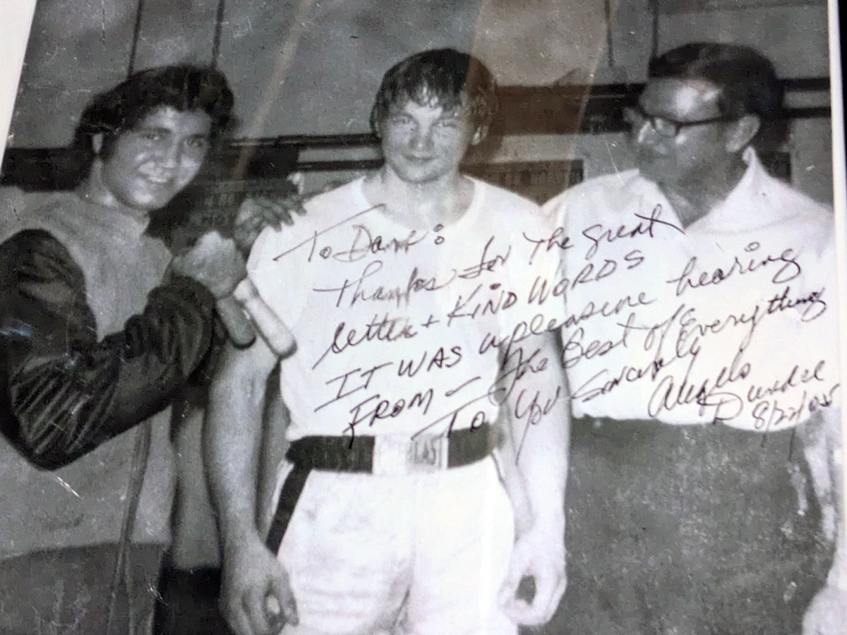 A signed photograph of Angelo Dundee hanging in Front Range Boxing Academy in Boulder