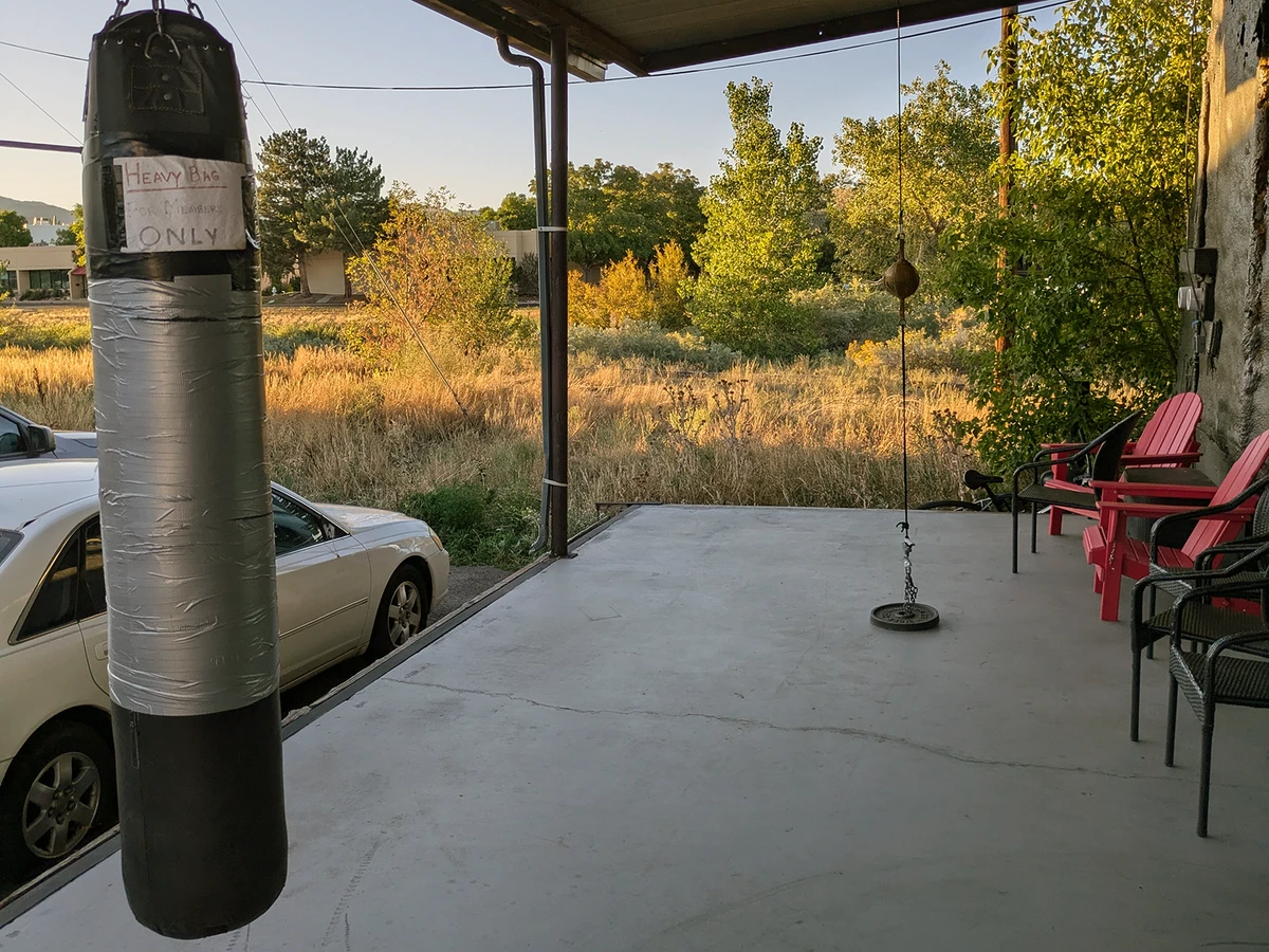 The patio with a heavy bag and speed bag at Front Range Boxing Academy in Boulder