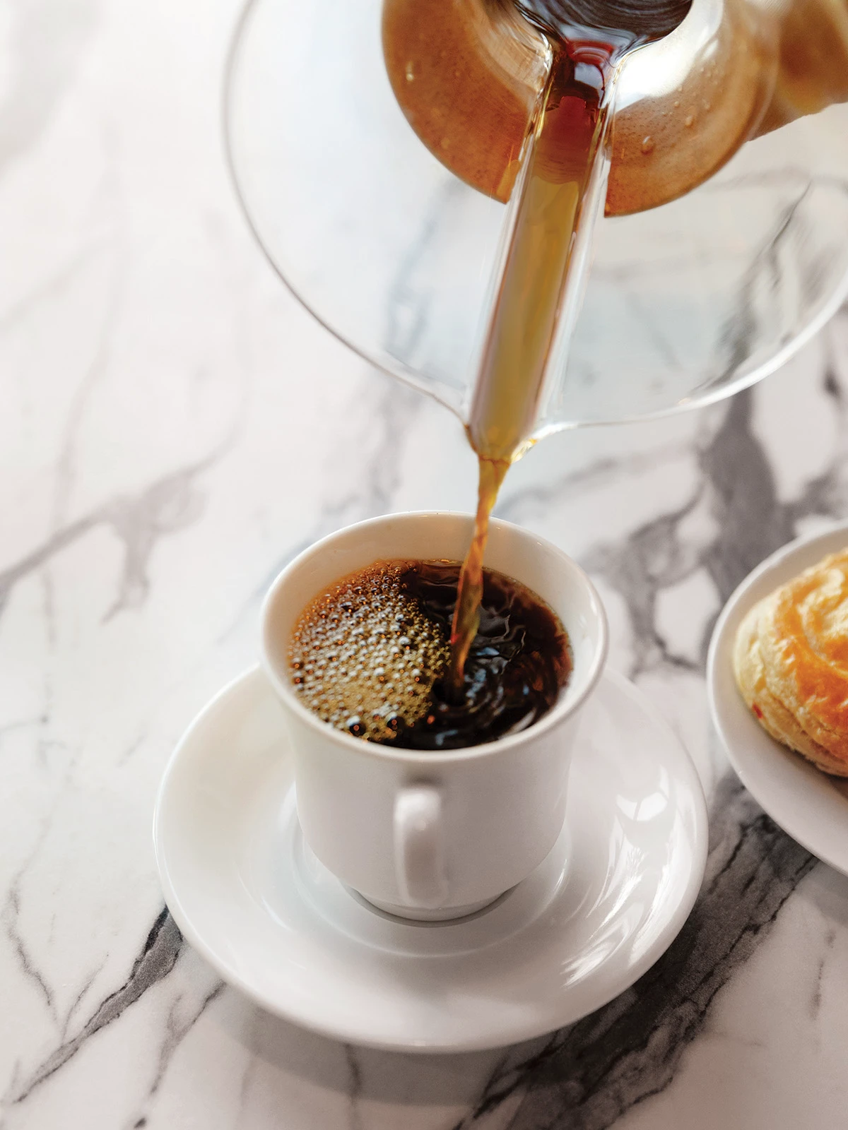 Pouring coffee into cup