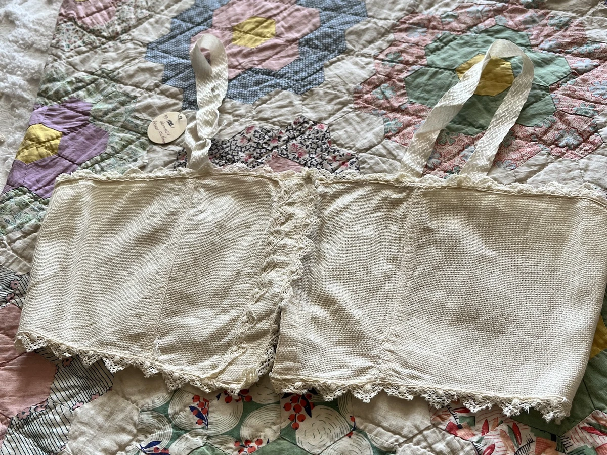 A chest-flattening bra on a vintage quilt