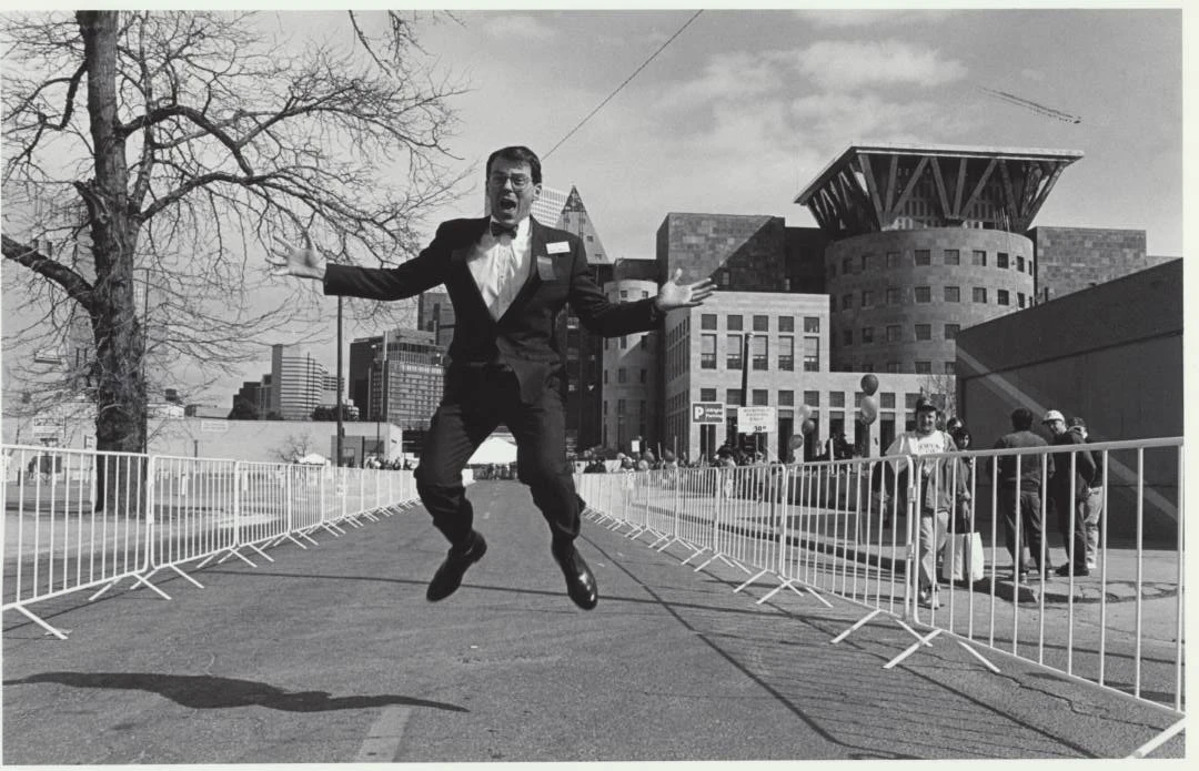 A librarian jumps outside Central Library, photo by Robert Weinberg