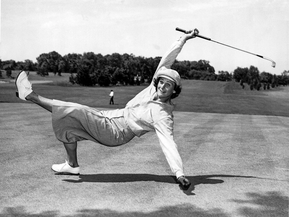 B&W image of woman kicking in joy