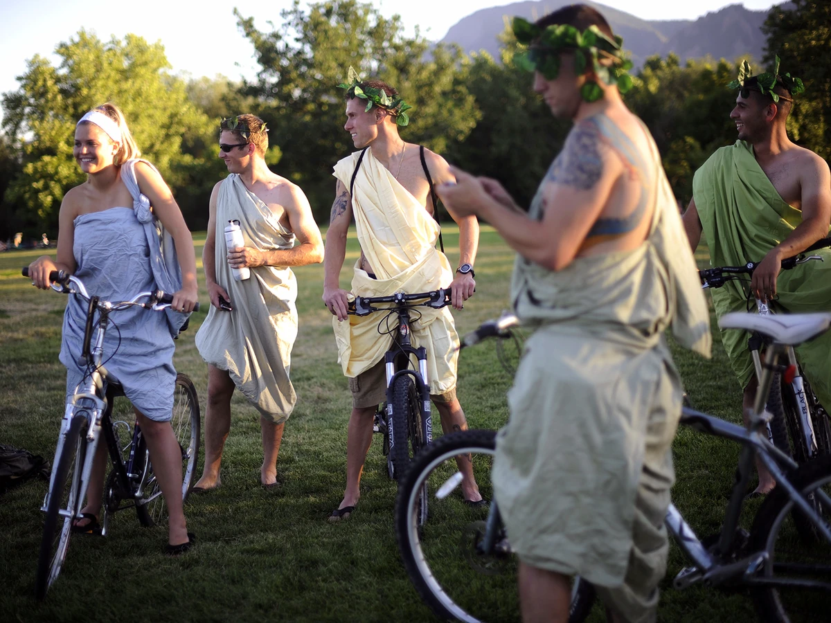 People wearing togas sit on bicycles in Boulder, Colorado