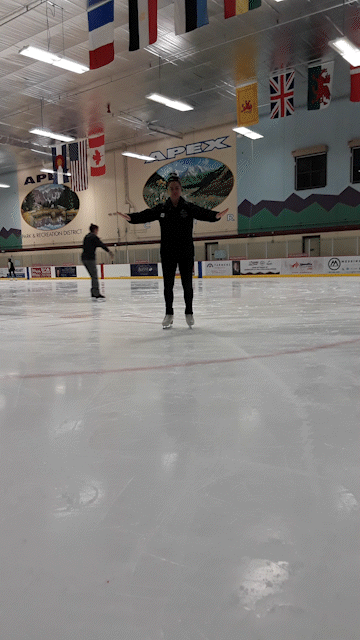 An ice skating coach shows how to push off and glide.