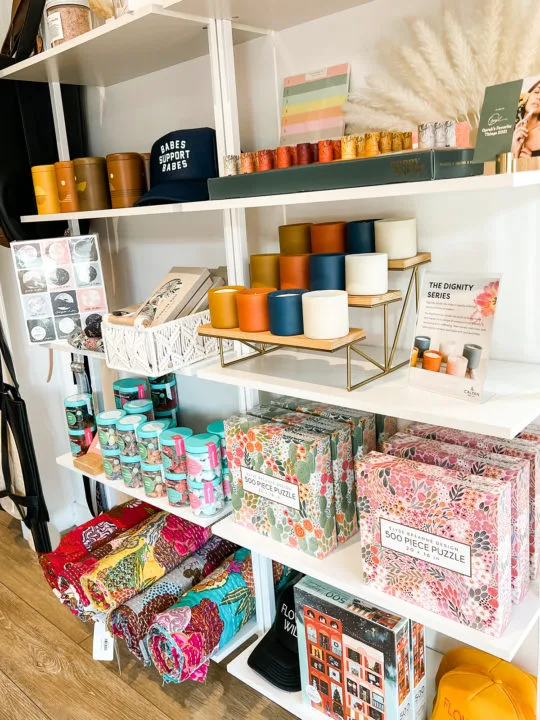 Candles, candy, and other accessories inside the Flower Wild Boulder storefront