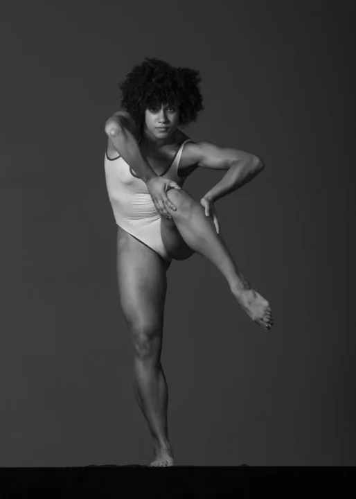 Natalia Roberts in black and white, dancing.