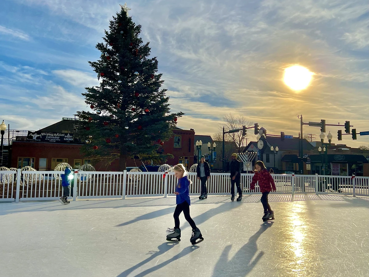 Folks ice skating at Skating in the Square in Olde Town Arvada