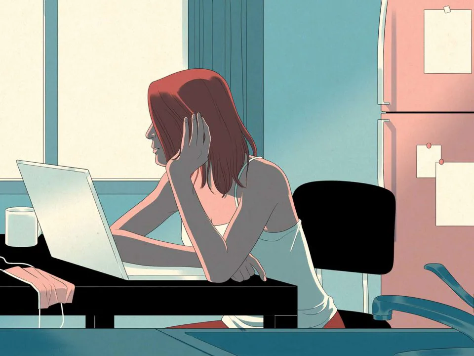 Woman writing at her computer.