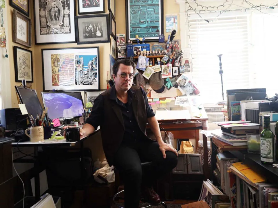 Cartoonist Karl Christian Krumpholz in his home studio in Denver. 