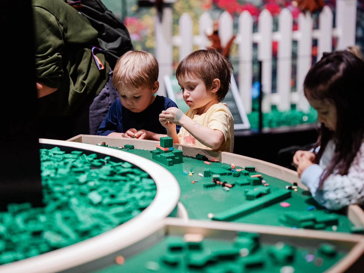 Children playing with Lego bricks at Brick Planet in Denver